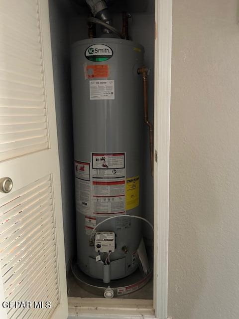utility room with water heater