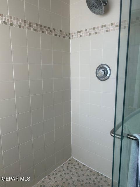 bathroom featuring a shower stall