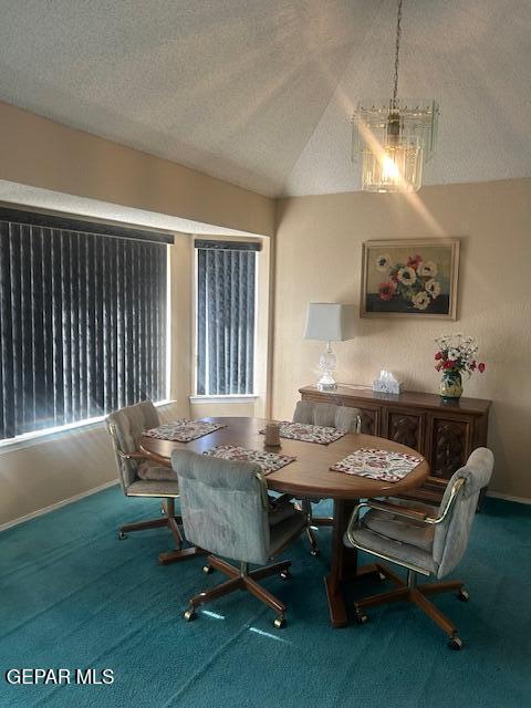 dining space with an inviting chandelier, lofted ceiling, baseboards, breakfast area, and carpet