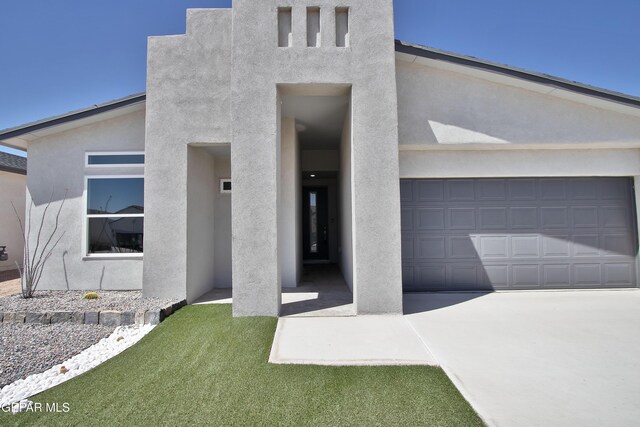 15237 Gauge Ct, El Paso, TX 79938 - view of front of property with stucco siding and concrete driveway