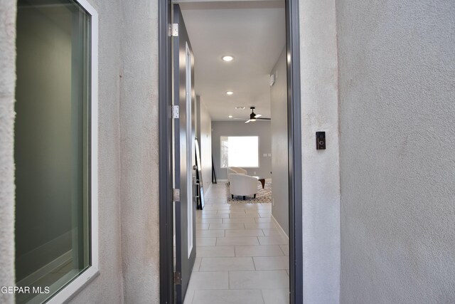 15237 Gauge Ct, El Paso, TX 79938 - corridor with recessed lighting, a textured wall, and light tile patterned floors