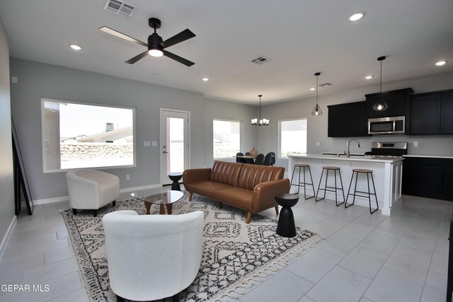 15237 Gauge Ct, El Paso, TX 79938 - living area with baseboards, ceiling fan with notable chandelier, recessed lighting, and visible vents