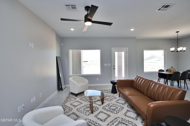 15237 Gauge Ct, El Paso, TX 79938 - living room with visible vents, recessed lighting, baseboards, and ceiling fan with notable chandelier