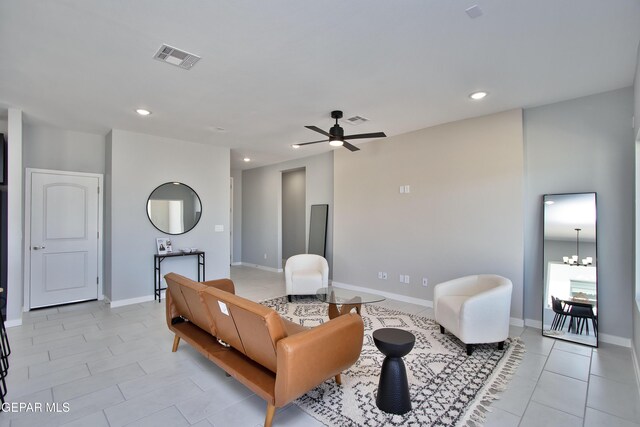 15237 Gauge Ct, El Paso, TX 79938 - living room with recessed lighting, visible vents, light tile patterned floors, and ceiling fan with notable chandelier