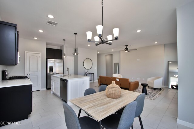 15237 Gauge Ct, El Paso, TX 79938 - dining space featuring visible vents, baseboards, recessed lighting, ceiling fan with notable chandelier, and light tile patterned floors