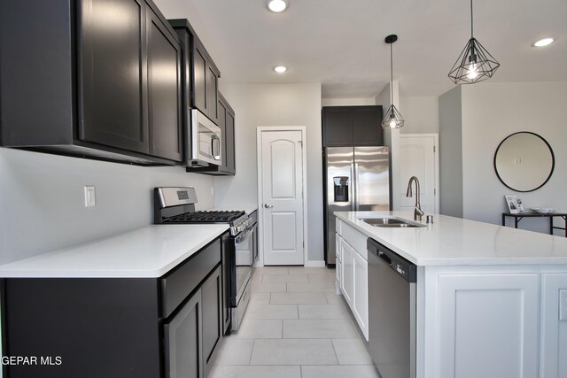 15237 Gauge Ct, El Paso, TX 79938 - kitchen with pendant lighting, a sink, light tile patterned floors, light countertops, and stainless steel appliances