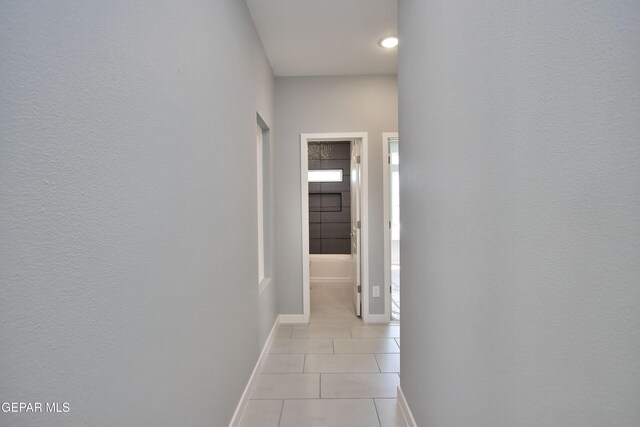 15237 Gauge Ct, El Paso, TX 79938 - corridor with light tile patterned floors and baseboards