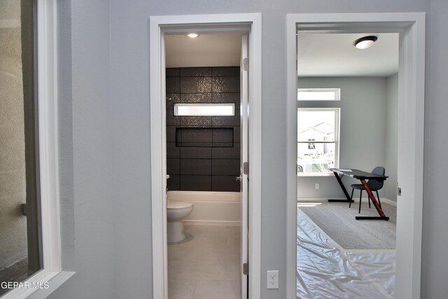 15237 Gauge Ct, El Paso, TX 79938 - full bath with baseboards, a washtub, and toilet