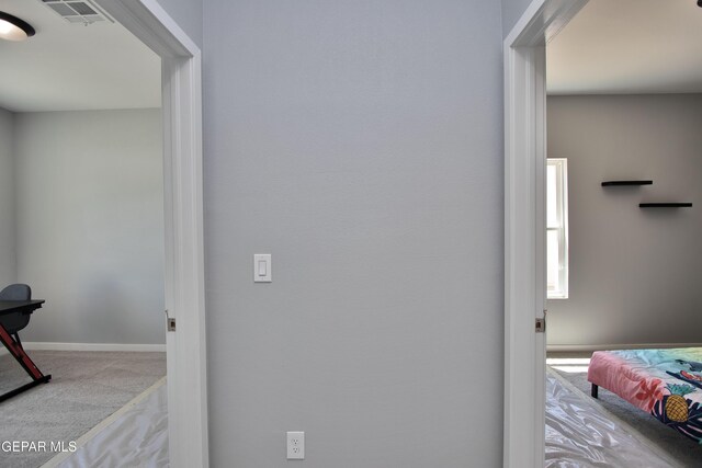 15237 Gauge Ct, El Paso, TX 79938 - hallway featuring carpet floors, baseboards, and visible vents