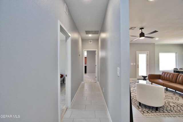 15237 Gauge Ct, El Paso, TX 79938 - hallway with visible vents, baseboards, and light tile patterned flooring