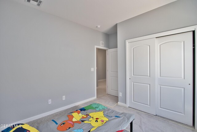 15237 Gauge Ct, El Paso, TX 79938 - bedroom with baseboards, light carpet, and visible vents