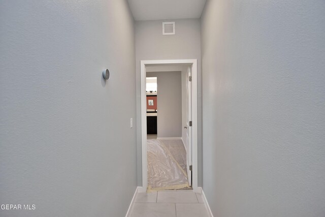 15237 Gauge Ct, El Paso, TX 79938 - corridor featuring visible vents, baseboards, and light tile patterned flooring