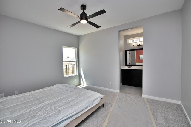 15237 Gauge Ct, El Paso, TX 79938 - carpeted bedroom with connected bathroom, a ceiling fan, and baseboards