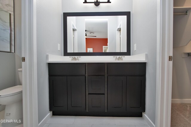 15237 Gauge Ct, El Paso, TX 79938 - full bath with double vanity, baseboards, toilet, and a sink