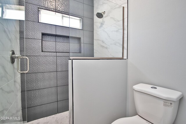 15237 Gauge Ct, El Paso, TX 79938 - bathroom featuring a stall shower and toilet
