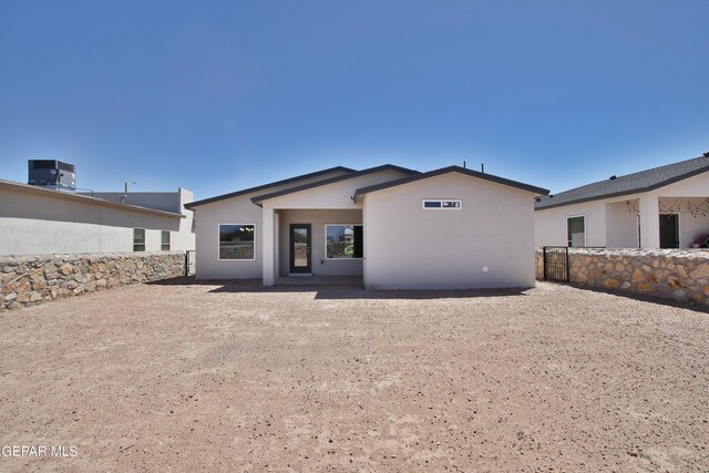 15237 Gauge Ct, El Paso, TX 79938 - rear view of property featuring central AC and stucco siding