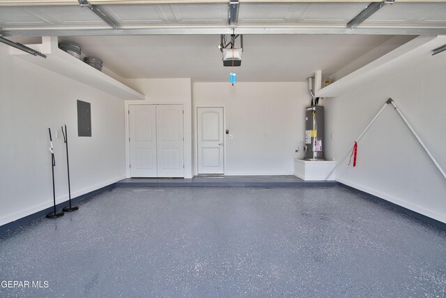 15237 Gauge Ct, El Paso, TX 79938 - garage with baseboards, a garage door opener, water heater, and electric panel