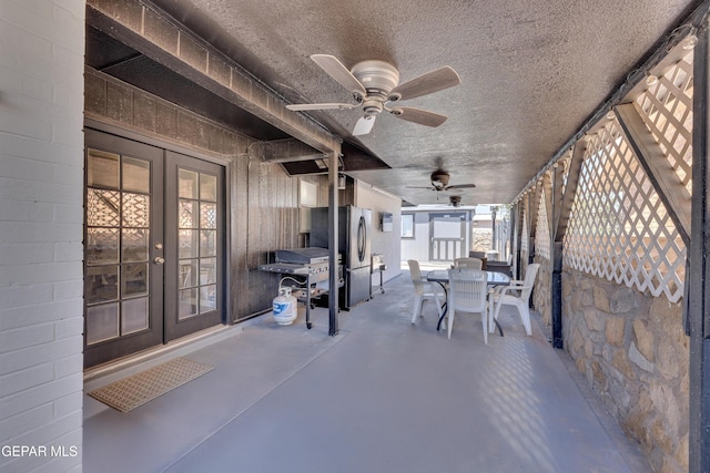 view of patio featuring a ceiling fan, french doors, and outdoor dining space