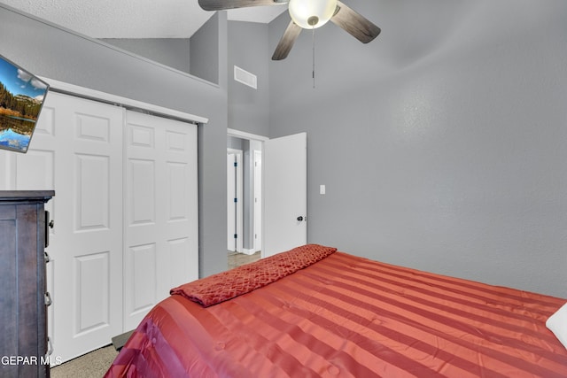 bedroom featuring visible vents, high vaulted ceiling, a closet, and ceiling fan