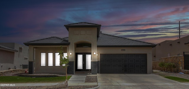 13408 Emerald Glass Dr, Horizon City, TX 79928 - view of front of house with an attached garage, driveway, stucco siding, and a tiled roof