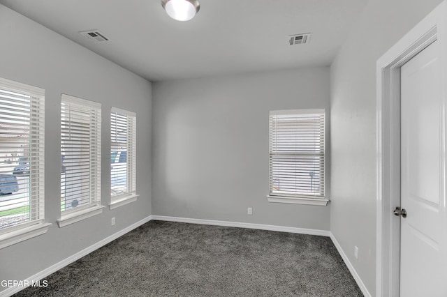 13408 Emerald Glass Dr, Horizon City, TX 79928 - unfurnished room featuring dark colored carpet and baseboards