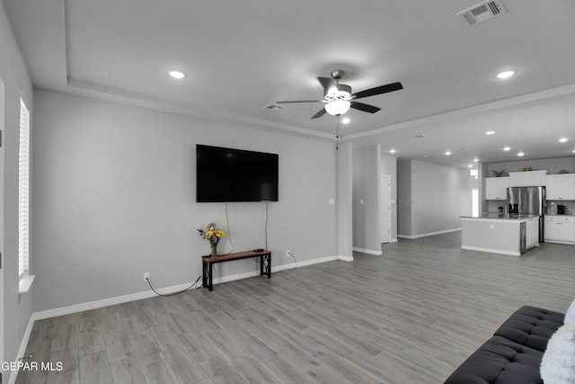 13408 Emerald Glass Dr, Horizon City, TX 79928 - unfurnished living room featuring a ceiling fan, recessed lighting, baseboards, and light wood-style floors