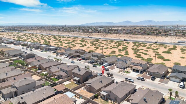 birds eye view of property featuring a mountain view and a residential view