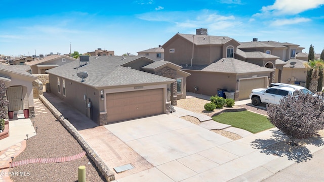 view of front of property featuring a garage, stucco siding, concrete driveway, and a residential view