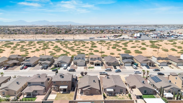 birds eye view of property featuring a mountain view and a residential view