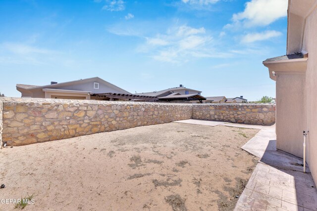 view of yard featuring a fenced backyard and a patio area