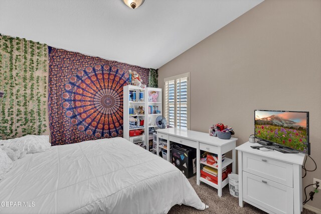 carpeted bedroom with vaulted ceiling