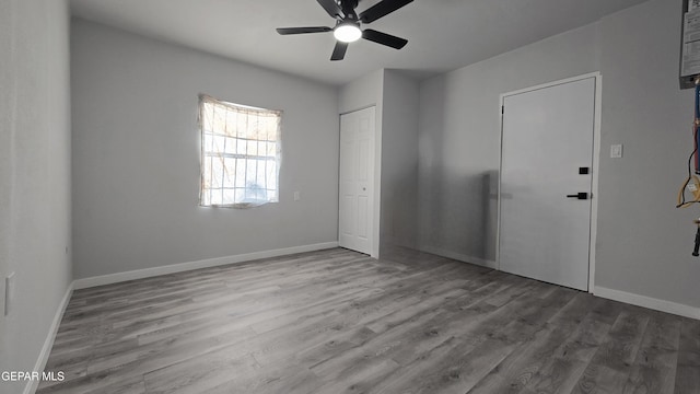 209 Hardesty Pl Unit 1 & 2, El Paso, TX 79905 - unfurnished bedroom with wood finished floors, a closet, and baseboards