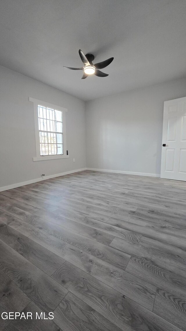 209 Hardesty Pl Unit 1 & 2, El Paso, TX 79905 - empty room with wood finished floors, a ceiling fan, and baseboards