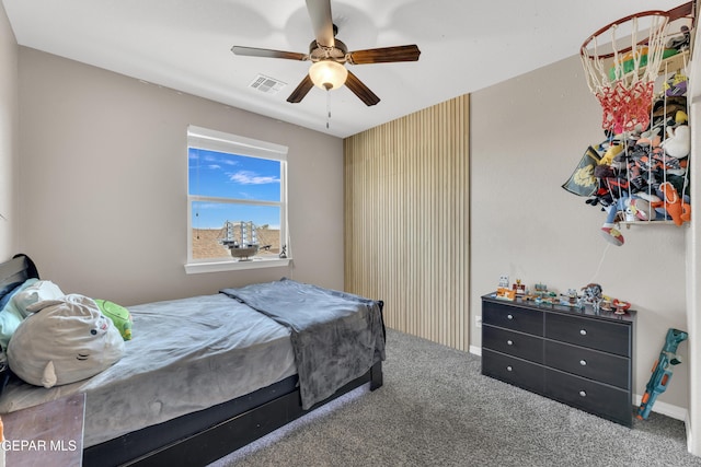 carpeted bedroom with ceiling fan and visible vents