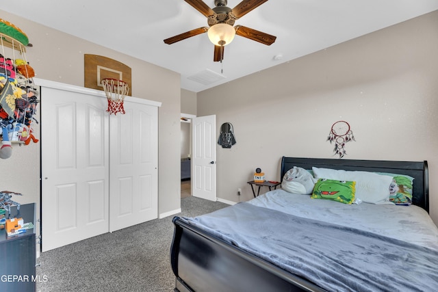 carpeted bedroom featuring a closet, baseboards, ceiling fan, and visible vents