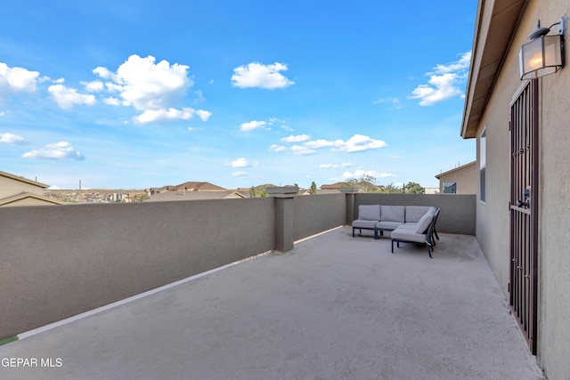 view of patio with outdoor lounge area and a balcony