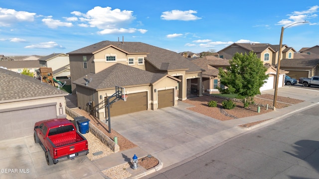 traditional-style home featuring driveway, roof with shingles, a residential view, an attached garage, and stucco siding