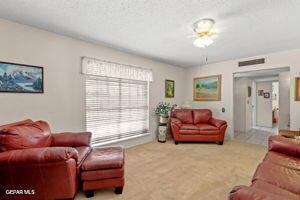 1421 Monte Negro Dr, El Paso, TX 79935 - carpeted living area featuring visible vents