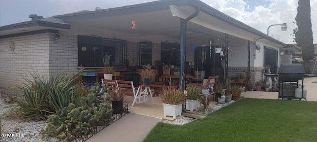 1421 Monte Negro Dr, El Paso, TX 79935 - view of home's exterior featuring a lawn and a patio area