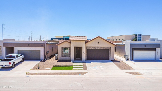 14940 Tierra Escape Ave, El Paso, TX 79938 - view of front facade with driveway, a tile roof, and stucco siding