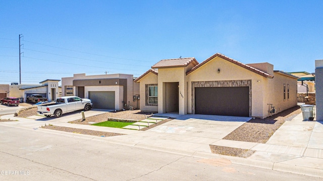 14940 Tierra Escape Ave, El Paso, TX 79938 - mediterranean / spanish-style house featuring a garage, stucco siding, concrete driveway, and a tiled roof