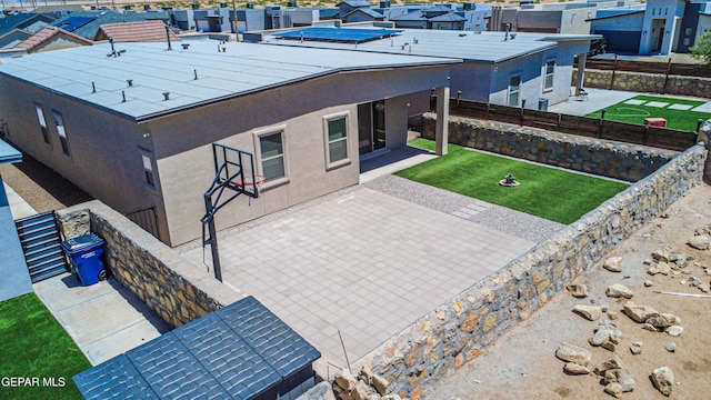 14940 Tierra Escape Ave, El Paso, TX 79938 - exterior space with a fenced backyard, stucco siding, and a patio area