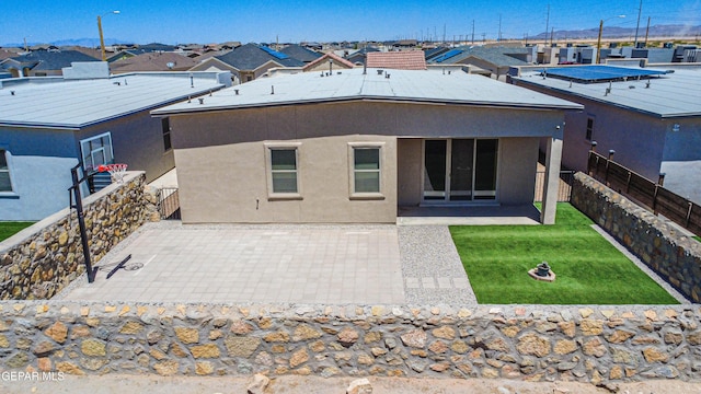 14940 Tierra Escape Ave, El Paso, TX 79938 - rear view of house featuring a fenced backyard, a patio, stucco siding, and a lawn