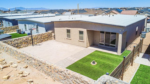 14940 Tierra Escape Ave, El Paso, TX 79938 - rear view of property with a fenced backyard, a patio area, stucco siding, and a residential view