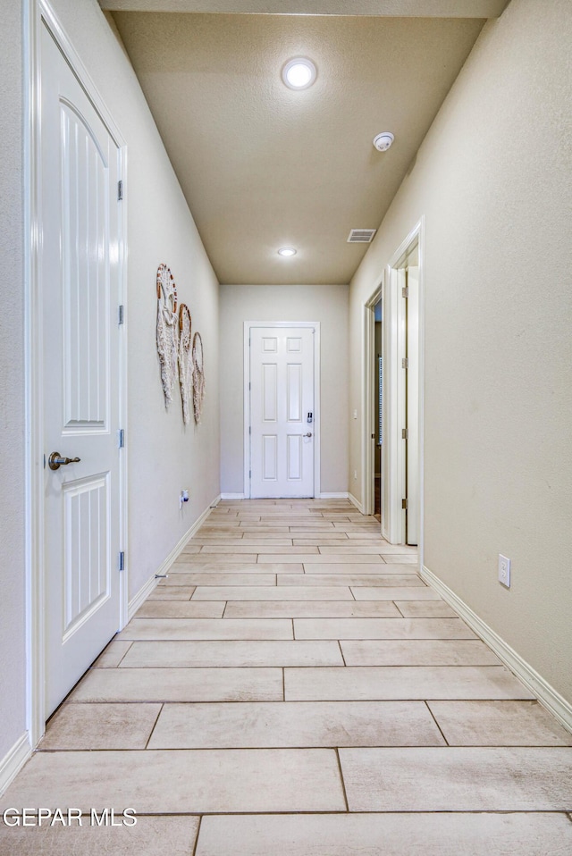 14940 Tierra Escape Ave, El Paso, TX 79938 - corridor featuring recessed lighting, baseboards, light wood finished floors, and visible vents