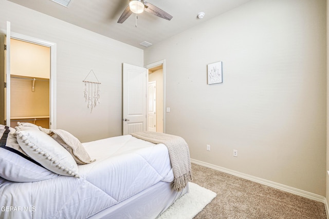 14940 Tierra Escape Ave, El Paso, TX 79938 - carpeted bedroom with ceiling fan, a walk in closet, baseboards, visible vents, and a closet
