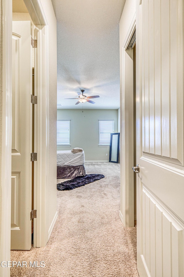 14940 Tierra Escape Ave, El Paso, TX 79938 - hallway featuring baseboards and carpet