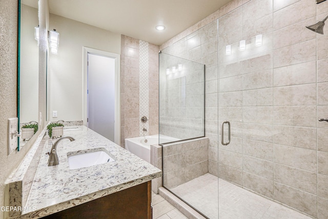 14940 Tierra Escape Ave, El Paso, TX 79938 - bathroom with a sink, a shower stall, recessed lighting, and double vanity