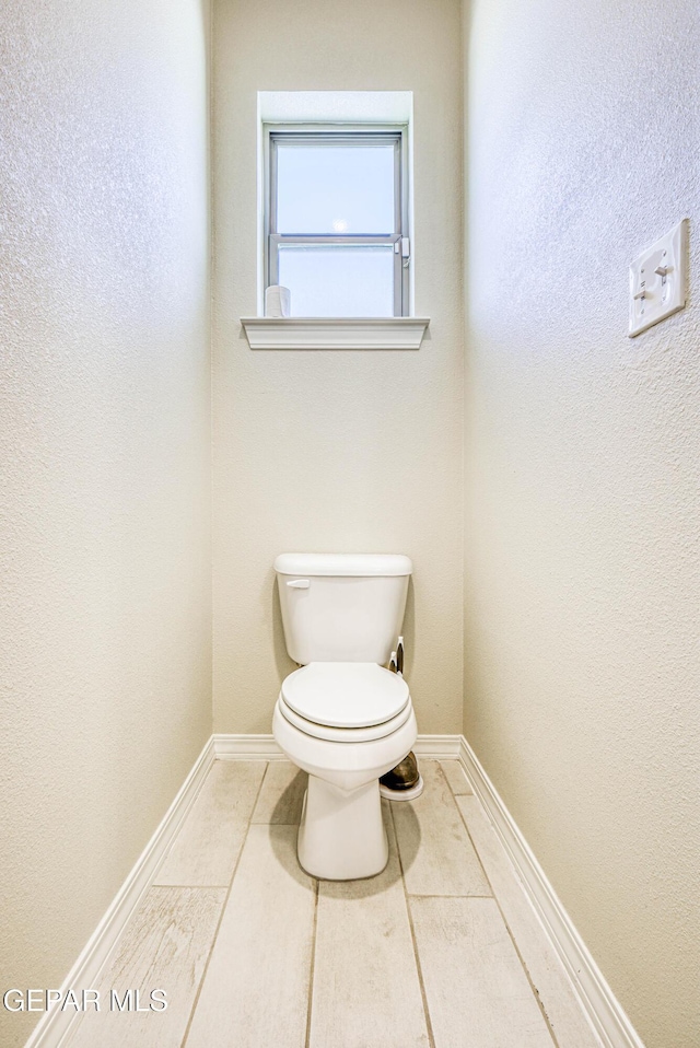 14940 Tierra Escape Ave, El Paso, TX 79938 - bathroom with toilet, baseboards, a textured wall, and tile patterned flooring