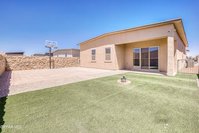 14940 Tierra Escape Ave, El Paso, TX 79938 - rear view of property featuring a yard, a patio, a fenced backyard, and stucco siding